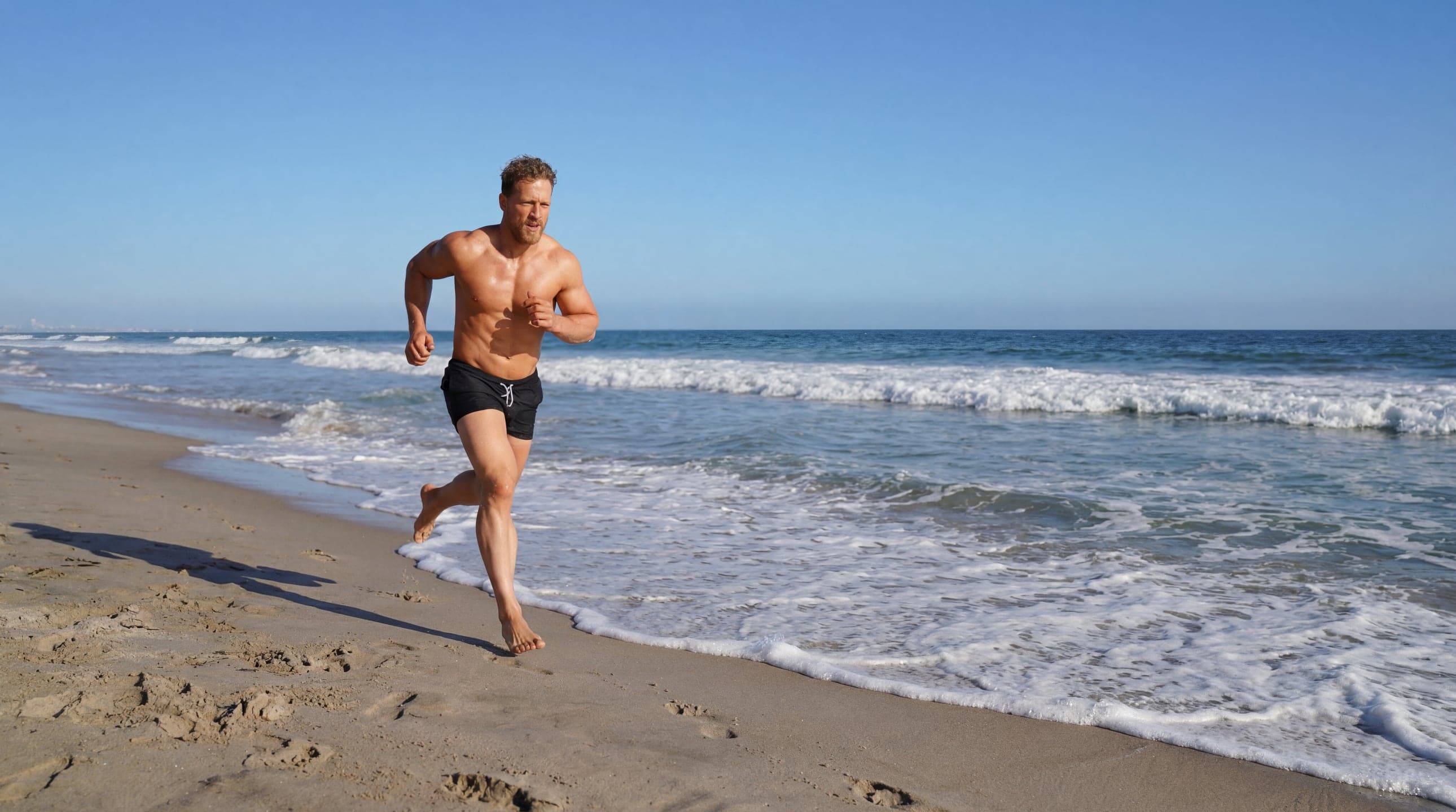 Alec Penix running on the beach